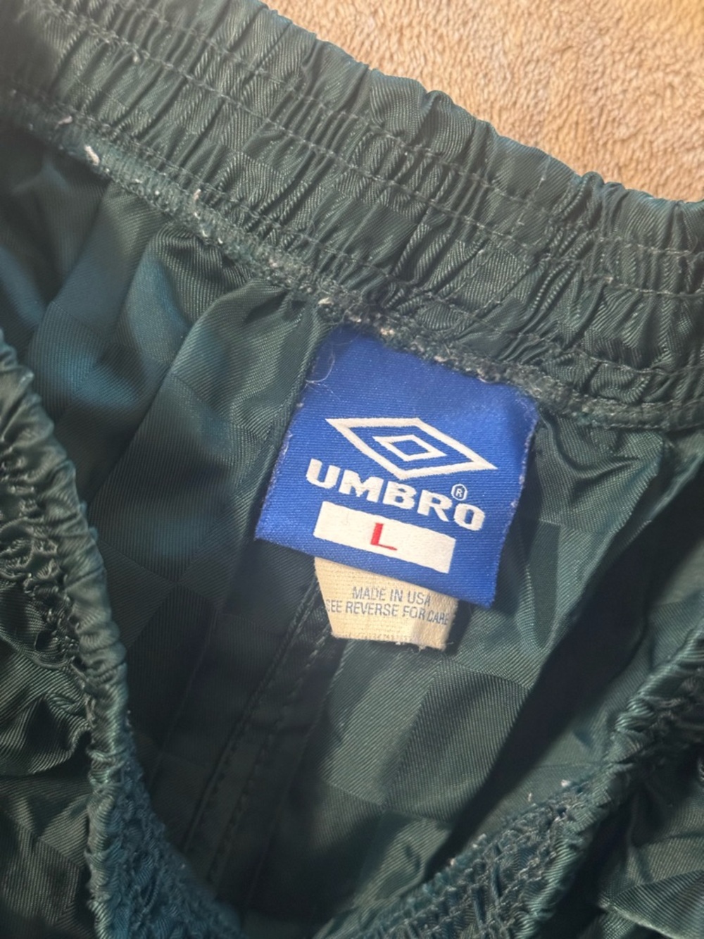 Umbro Dark Green Men's Athletic Shorts with Blue Logo Tag